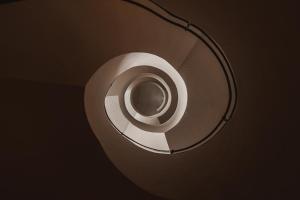 a roll of paper hanging from a light fixture at stieg'nhaus Design Boutique Hotel in Mühlbach am Hochkönig