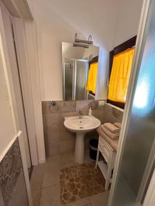 a bathroom with a sink and a mirror at IL PARADISO delle farfalle in Santa Maria degli Angeli +14 photos