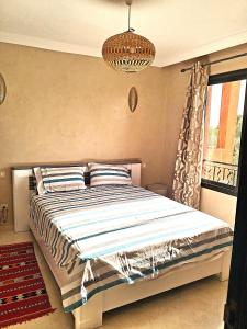 Postel nebo postele na pokoji v ubytování L'ECRIN de la PALMERAIE + 56 fotografií