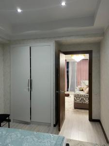 a room with a door leading to a bedroom at Апартамент,Новел отель,село Корумду in Korumdy