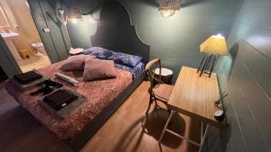 a small bedroom with a bed and a table at La Collina Dei Castagni in Terni +35 photos