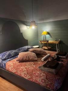 a bed with two pillows on it in a room at La Collina Dei Castagni in Terni +43 photos