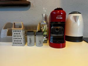 a bottle of wine and other kitchen items on a table at La Collina Dei Castagni in Terni