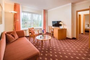 TV a/nebo společenská místnost v ubytování Hotel Inselfriede