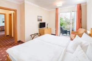 Postel nebo postele na pokoji v ubytování Hotel Inselfriede