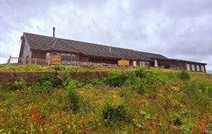 a house sitting on top of a hill at Auchenhill Lodge in Denny