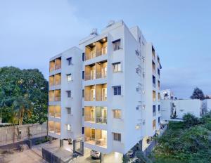 an overhead view of a white apartment building at Acasa Suites - ITPL Whitefield, Near Manipal Hospital in Bengaluru