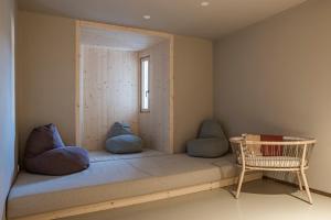 A bed or beds in a room at Engel Gourmet&Spa