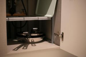 a small bathroom with a toilet in a stall at Staymuk Seochon, Center of Seoul in Seoul +67 photos