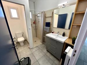 a bathroom with a sink and a toilet and a shower at Parenthèse à la Maison de Gilda in Eygalières +15 photos