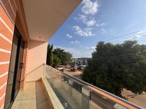 a balcony of a building with a view of a street at D-GioGiNi Apartments in Gwarinpa