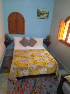Postel nebo postele na pokoji v ubytování Riad ouhmidi