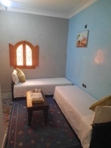 Postel nebo postele na pokoji v ubytování Riad ouhmidi