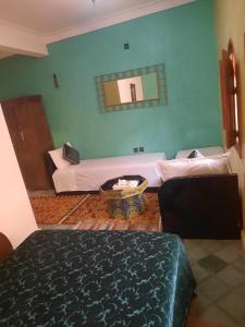 Postel nebo postele na pokoji v ubytování Riad ouhmidi