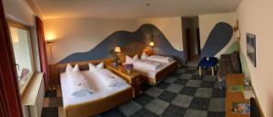 Postel nebo postele na pokoji v ubytování Hotel Schauinsland