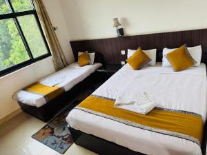 Postel nebo postele na pokoji v ubytování sakya guest house