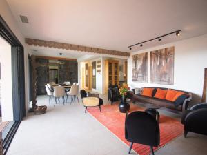 a living room with a couch and chairs at Carqueiranne: Villa de Charme avec Piscine, Vue Mer, pour 8 Personnes - FR-1-599-119 in Carqueiranne