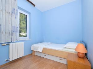 Postel nebo postele na pokoji v ubytování Apartment Vukadin