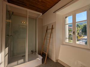 a bathroom with a shower and a ladder and a window at Gîte de caractère rénové, jusqu'à 10 pers., jardin privé, Haute-Loire - FR-1-582-534 in Saint-Arcons-de-Barges +27 photos