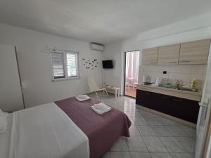 Postel nebo postele na pokoji v ubytování Batkoski Apartments