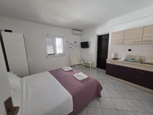 Postel nebo postele na pokoji v ubytování Batkoski Apartments