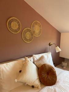 a bedroom with a bed with a large pillow on it at Atika Appartamento Relax a 10 min da Benevento in Benevento