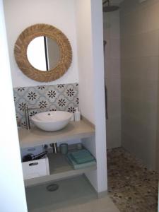 a bathroom with a sink and a mirror at TORRES DEL SOL A 50 metros playa las vistas in Playa de las Americas +8 photos