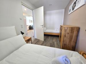 Ένα ή περισσότερα κρεβάτια σε δωμάτιο στο Apartment Rosmarin - Alpstay