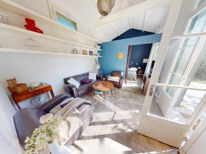 a living room with a couch and a table at Maison à Vic-la-Gardiole, 2 pers, Terrasse, Proche Plage - FR-1-785-25 in Vic-la-Gardiole