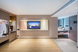 Kunming Meihao Lizhi Hotel Cuihu Park Yunnan University Hospital Branch房間的床
