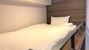 Postel nebo postele na pokoji v ubytování Hotel Gee Haive