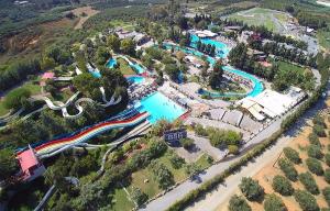 an overhead view of a water park with a pool at Veranda with Endless View among Orange Trees in Fournés