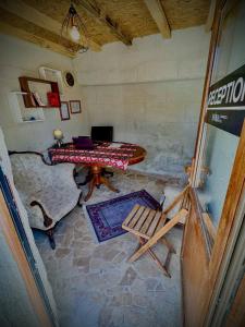 an overhead view of a room with a table and a chair at Evra Cappadocia Hotel in Nevşehir