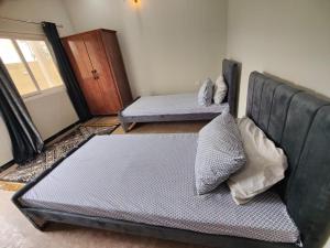Ένα ή περισσότερα κρεβάτια σε δωμάτιο στο Avenue Lodges