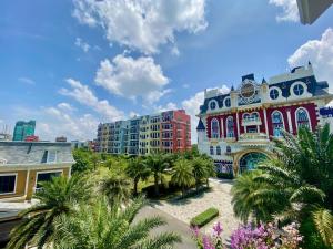 a view of a city with palm trees and buildings at Wonderland Royal Mansions Ho Tram in Xuyên Mộc