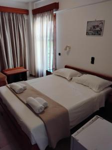 Una cama o camas en una habitación de Sama hotel