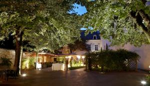 a courtyard of a house at night with lights at Maison Philippe Le Bon in Dijon