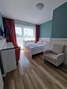 Łóżko lub łóżka w pokoju w obiekcie AGIS Pokoje Gościnne
