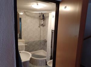 a bathroom with a sink and a toilet and a shower at Holiday Home Vucina in Sveti Juraj