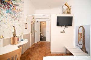 Televisor o centre d'entreteniment de Boutique Hotel Goldenes Lamm Villach