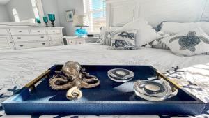a tray with an octopus on top of a bed at Boaters Dream S. Terr Pool Yacht Club Boating in Cape Coral