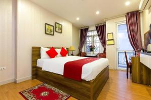 Postel nebo postele na pokoji v ubytování New Amely Hotel