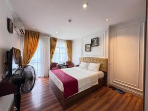 Postelja oz. postelje v sobi nastanitve New Amely Hotel
