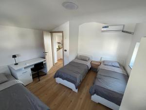 Postel nebo postele na pokoji v ubytování Piko's apartments