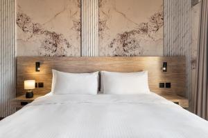 Postel nebo postele na pokoji v ubytování Regency Inn + 37 fotografií
