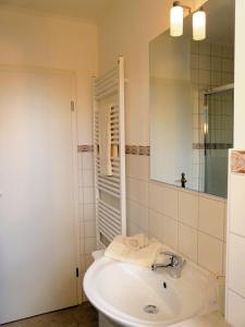 Ванная комната в Ferienhäuser Seewiesen