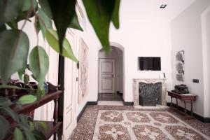 TV a/nebo společenská místnost v ubytování Residenza Bendinelli-Sauli