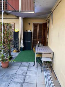 a table and chairs sitting on a patio at Da Alessandro in Biella +3 photos