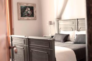 Postel nebo postele na pokoji v ubytování Residenza Bendinelli-Sauli
