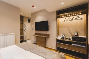 TV o dispositivi per l'intrattenimento presso Hotel Rezident